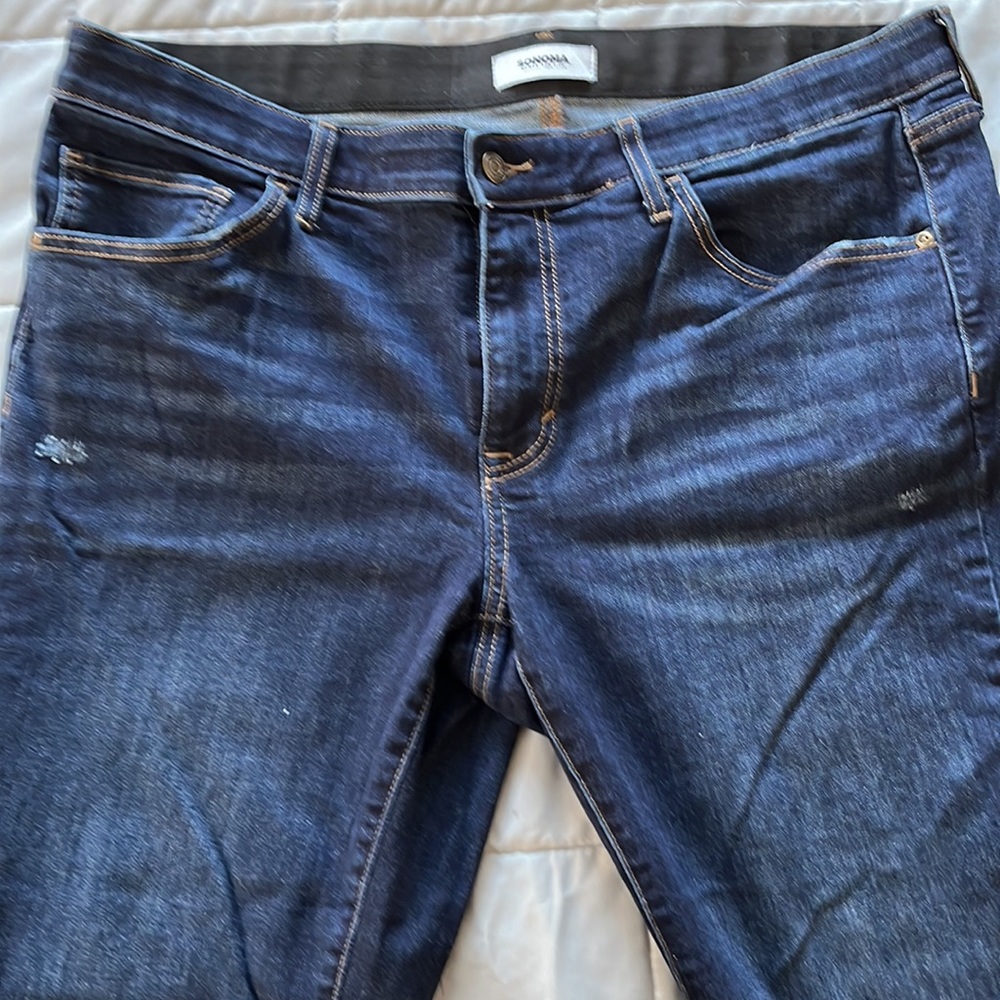 Women’s plus size dark denim jeans. 16WS